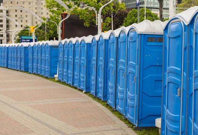 a row of portable restrooms at a fairground, offering visitors a clean and hassle-free experience in philipsburg